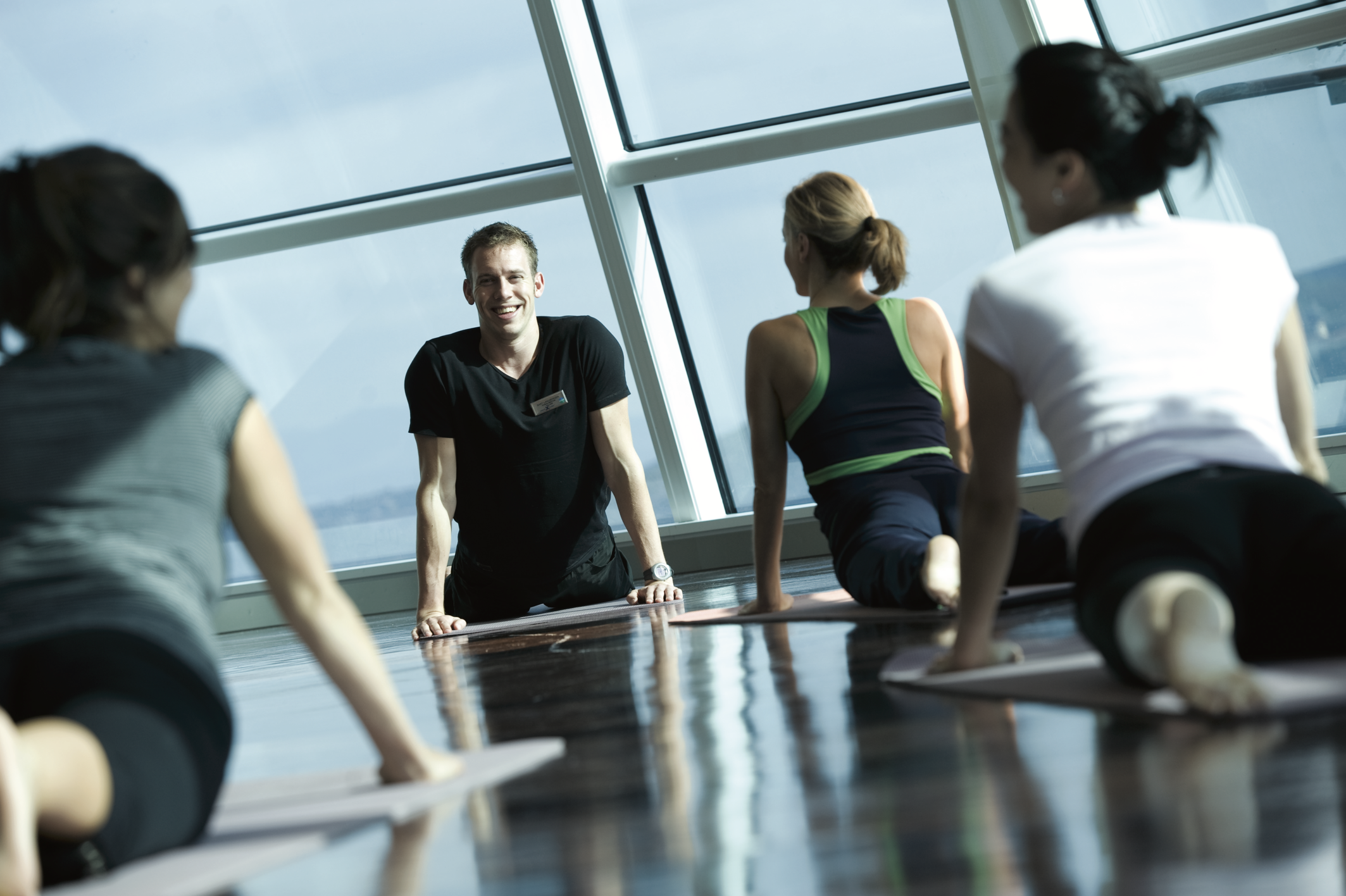 Group doing yoga onboard a Celebrity Cruise